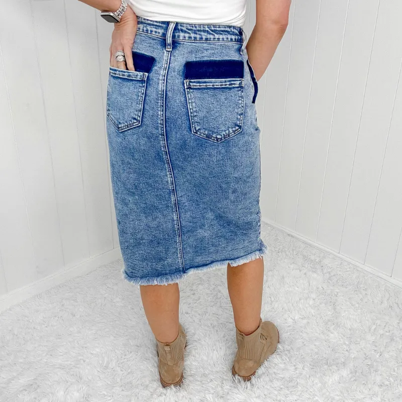 Sure! Here’s an optimized title for the product:

Blakeley Courtney Stylish Denim Skirt with Button and Slit Detail

This title includes modifiers to enhance clarity and appeal while highlighting key features of the product.