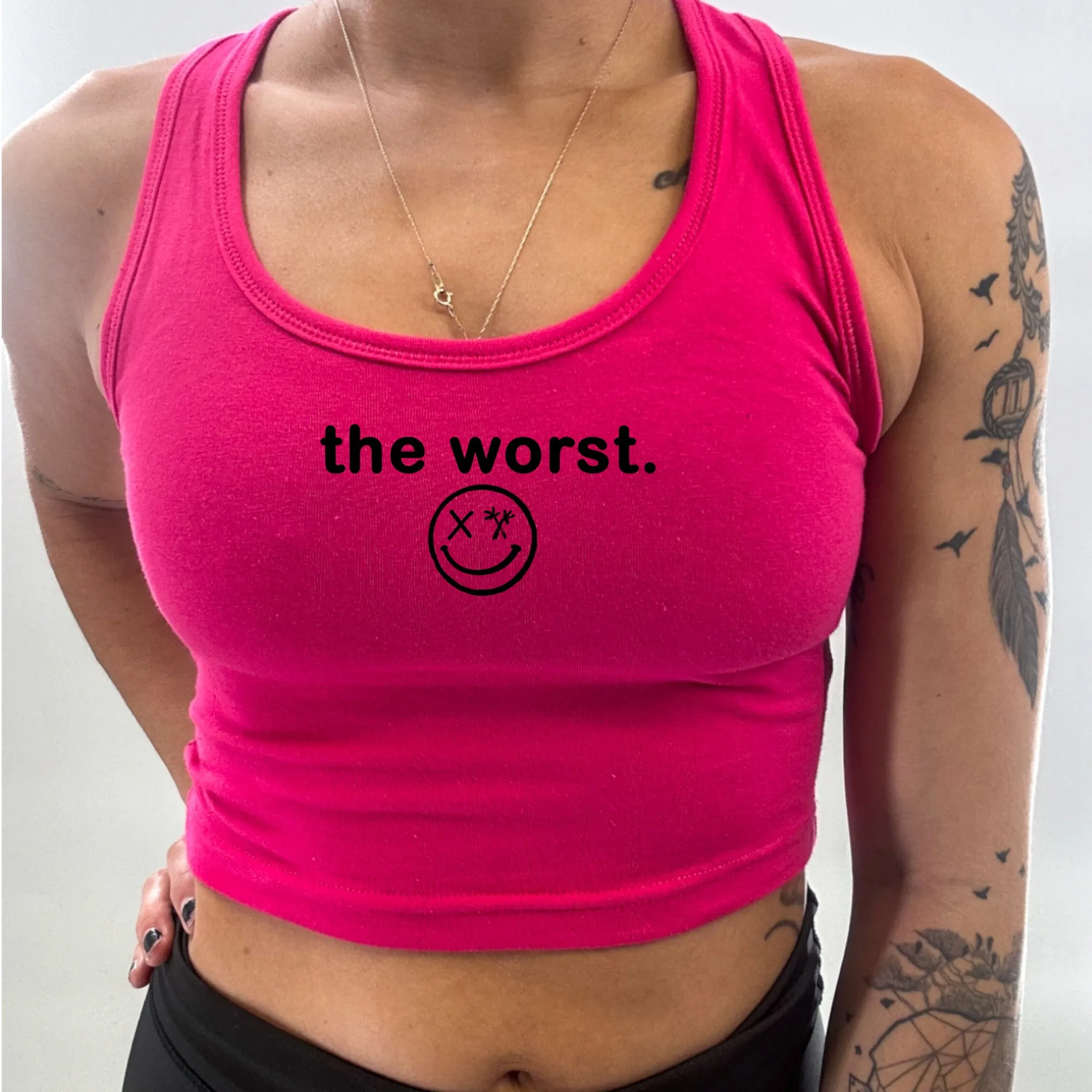 Ladies "the worst." Racerback Crop Tank | Micro